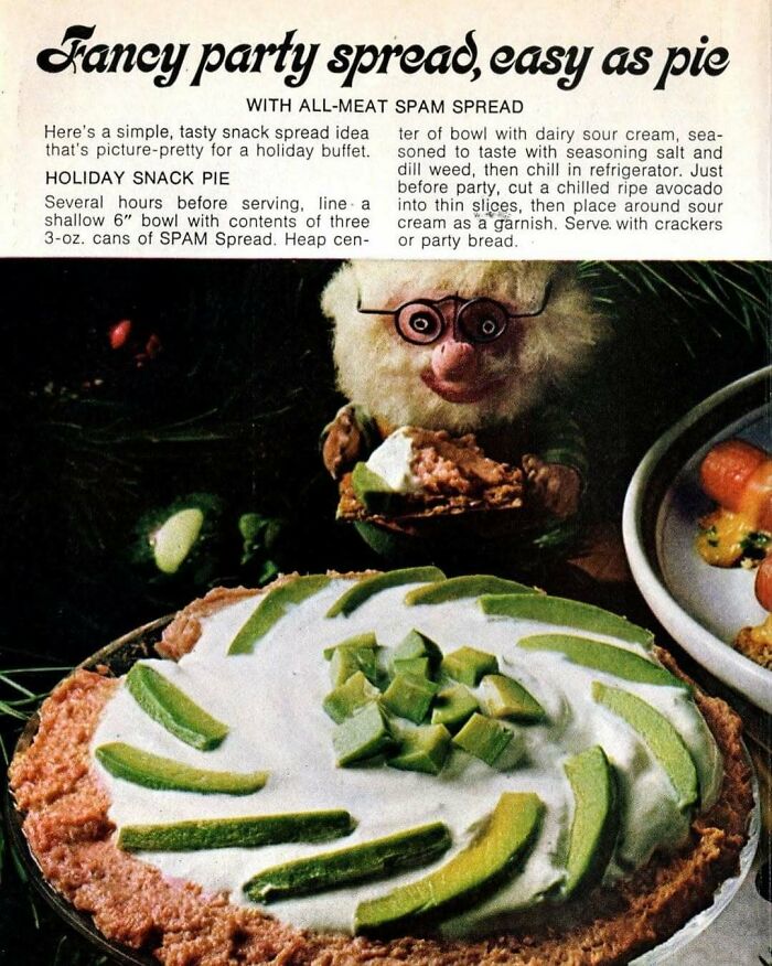 Vintage party spread with all-meat Spam spread topped with sour cream and avocado slices on a holiday snack pie.