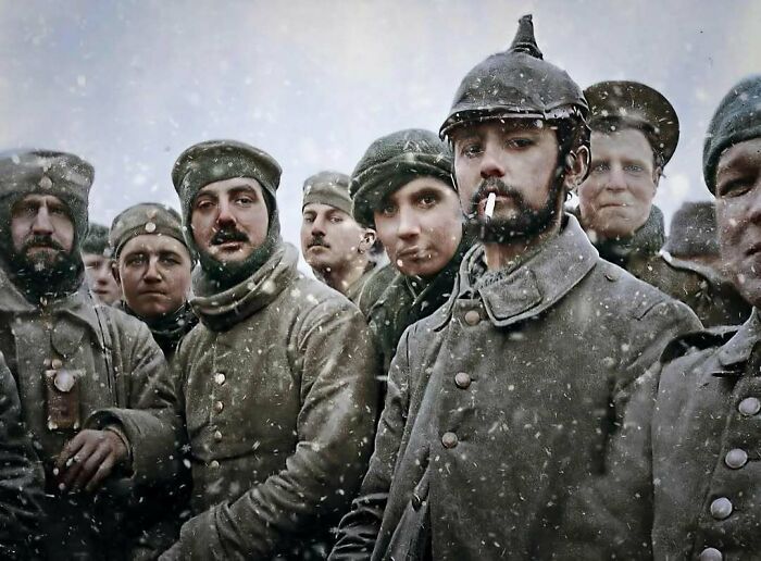 Group of Victorian era soldiers in winter uniforms standing together in snow, showing the weird photos from Victorian era.