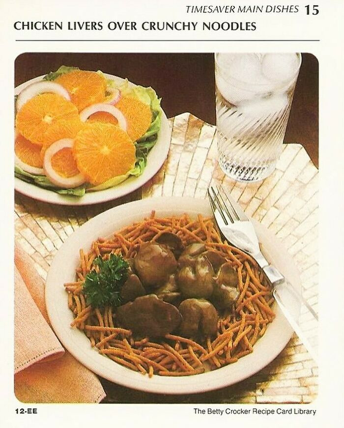 Vintage recipe card showing chicken livers over crunchy noodles with a side salad and a glass of water, classic Gen X meal.