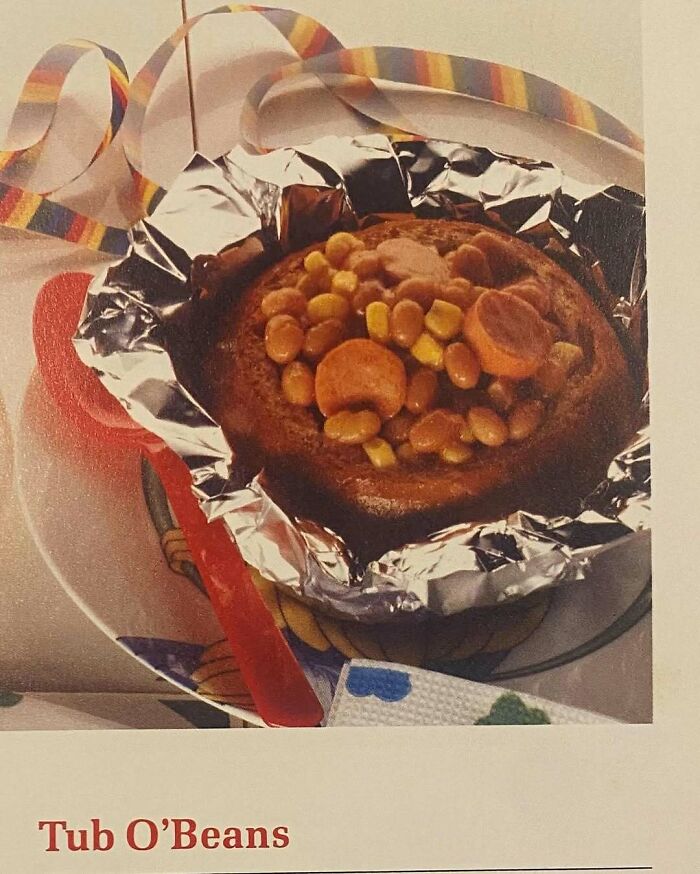 Vintage creative recipe featuring beans, corn, and sausage in foil, reflecting quirky Gen X cooking trends.