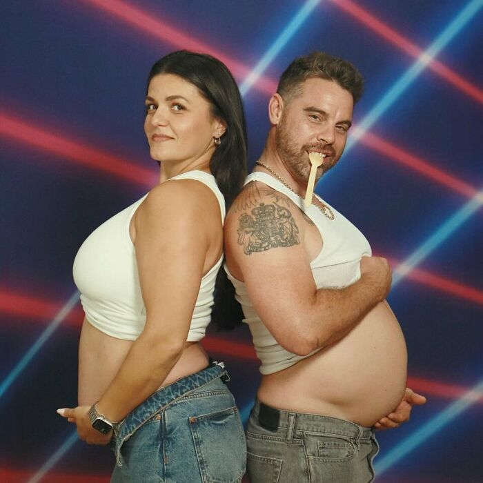 Couple posing back-to-back in awkward studio pics with retro laser background, both wearing white tops and jeans.