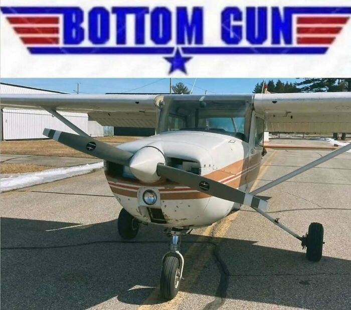 Small single-engine airplane on runway with a Bottom Gun logo, perfect for aviation memes about time spent in the air.