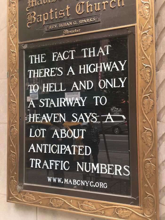 Baptist church sign featuring a humorous joke about the highway to hell and stairway to heaven traffic.