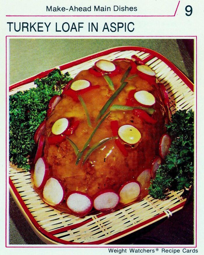 Vintage turkey loaf in aspic decorated with radish slices and herbs, showcasing creative vintage recipes for Gen X nostalgia.