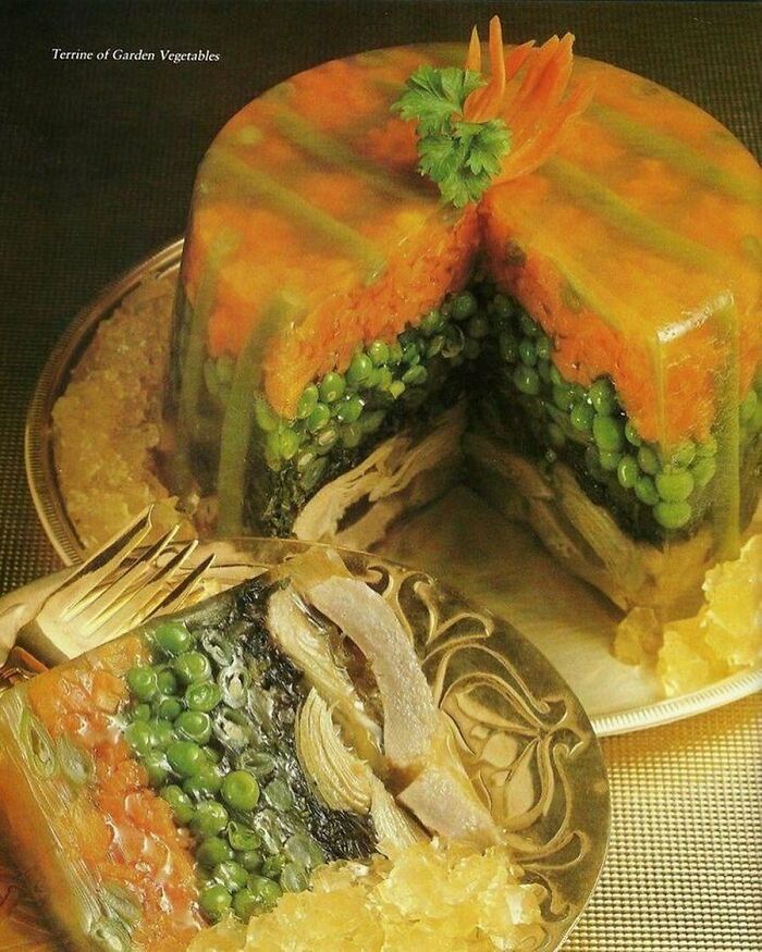 Terrine of garden vegetables vintage recipe featuring layered peas, carrots, and meat in gelatin, showcasing creative Gen X food ideas.
