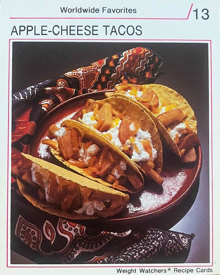 Vintage apple-cheese tacos on a plate with patterned cloth, showcasing disturbingly creative vintage recipes from Gen X era.