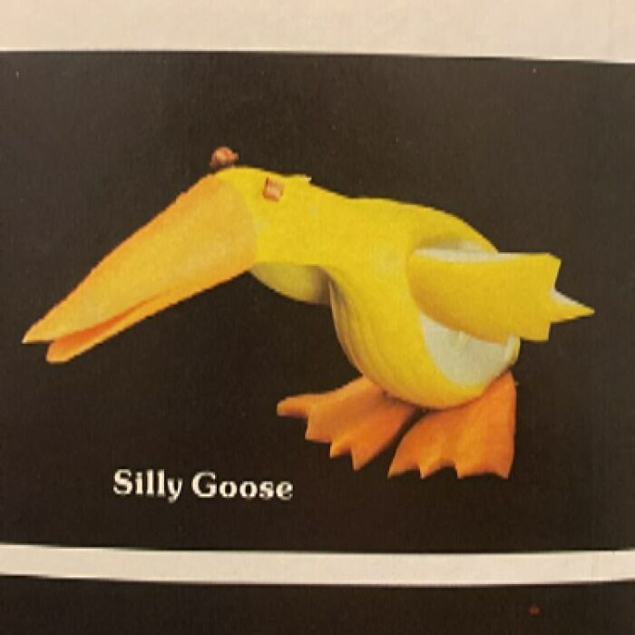 Vintage recipe food art shaped like a silly goose made from creatively carved fruit and vegetables.