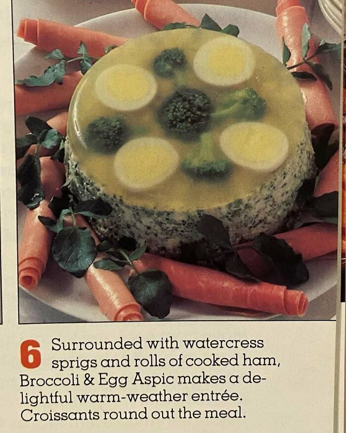 Vintage broccoli and egg aspic surrounded by watercress and ham rolls, showcasing creatively disturbing vintage recipes.