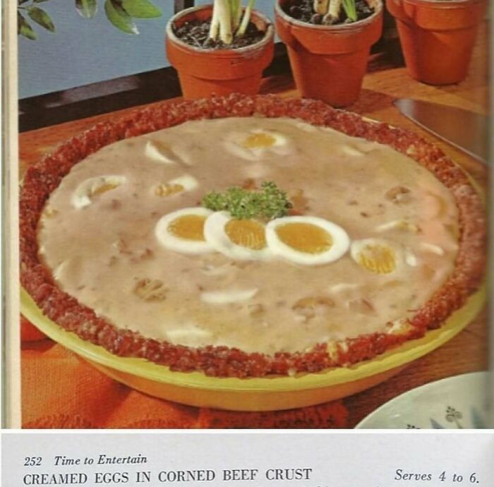 Vintage creamed eggs in corned beef crust pie with hard-boiled eggs and parsley, a creative vintage recipe from Gen X era.