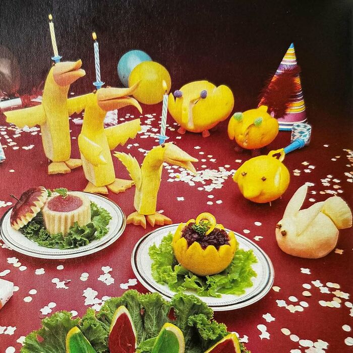 Vintage recipes creatively shaped into animals and party decorations on a festive red tablecloth with confetti.