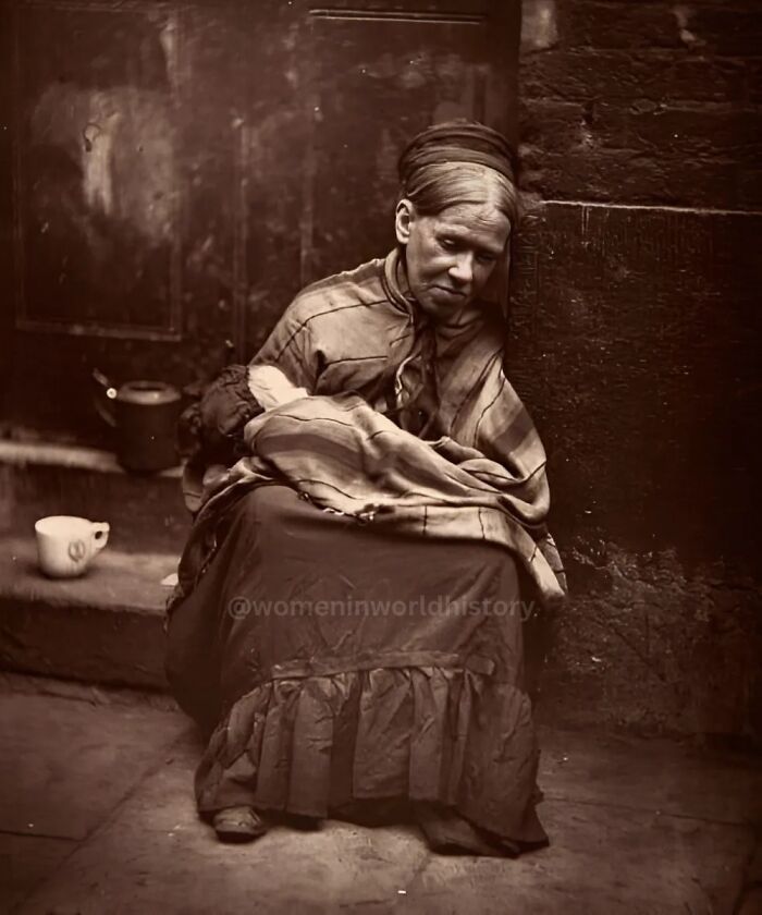 Woman sitting on a step in historical clothing, representing overlooked women in history and their important achievements.