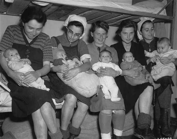 Group of women with babies in a historic black and white photo representing overlooked women in history and their achievements.