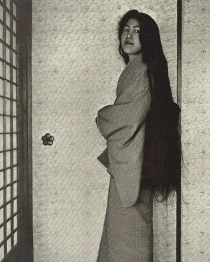 Historic image of a woman with long hair in traditional attire representing women overlooked in history achievements.