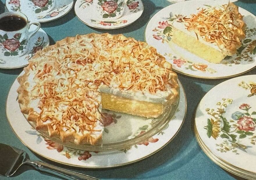 Vintage recipe coconut cream pie with toasted topping served on floral china plates alongside coffee cups.