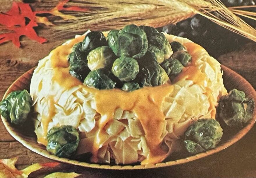Vintage recipe featuring a molded salad with Brussels sprouts and a creamy sauce, showcasing bizarre dishes from the past.