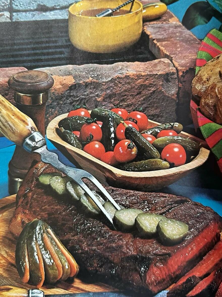 Vintage recipes featuring a cooked meat dish garnished with pickles and served with a bowl of pickles and cherry tomatoes.