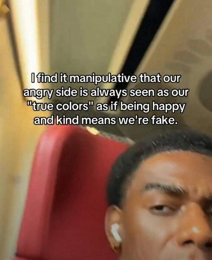 Man with earbuds sitting in a red seat with text about anger and kindness, related to laughgorithm memes.