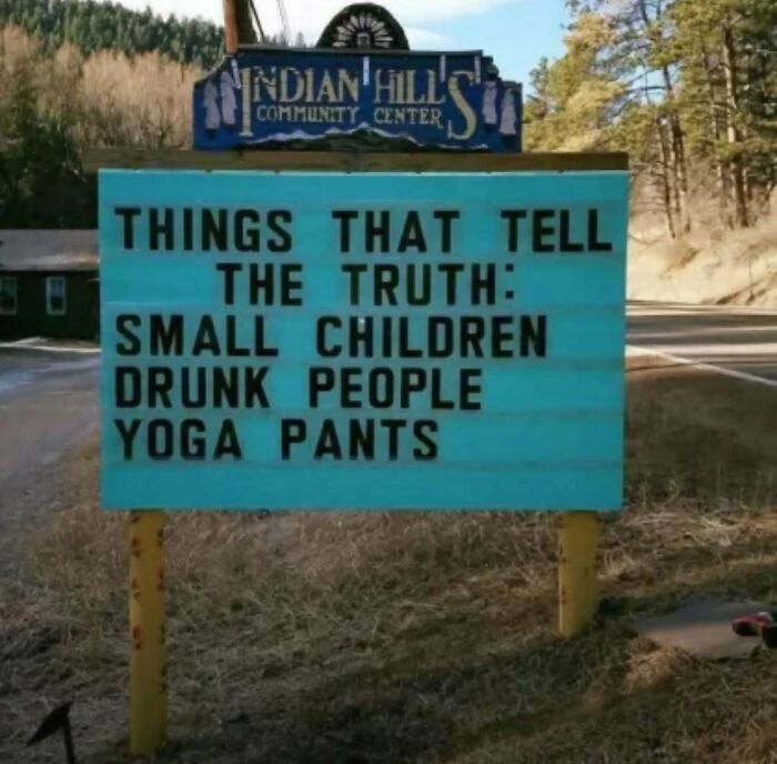 Outdoor sign at Indian Hills Community Center humorously listing small children, drunk people, and yoga pants as things that tell the truth.