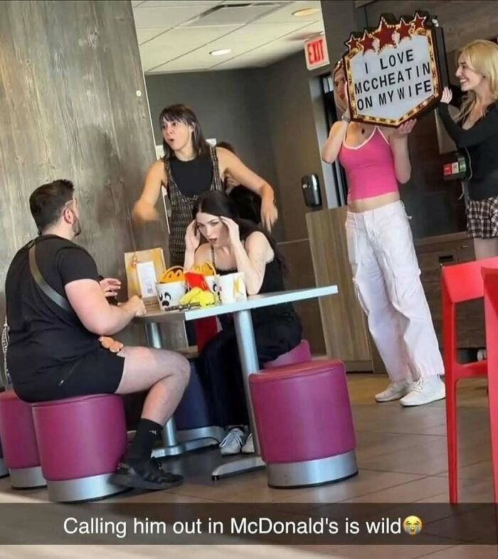 Group at McDonald's reacts to a shocking meme sign, capturing entertaining posts and memes to fight boredom and sadness.