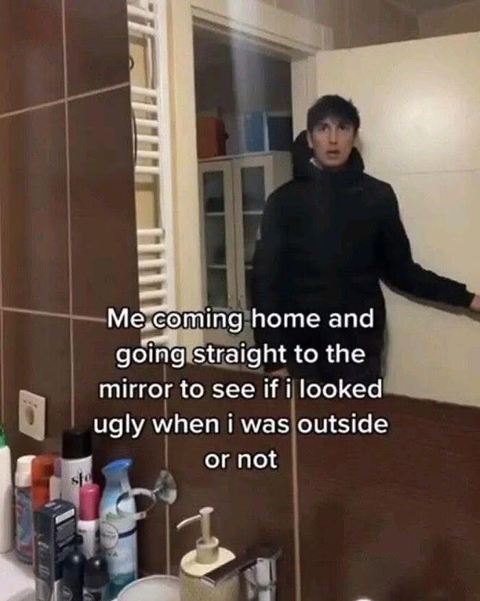 Person in a bathroom meme about checking appearance in the mirror, part of entertaining posts and memes on boredom and sadness.