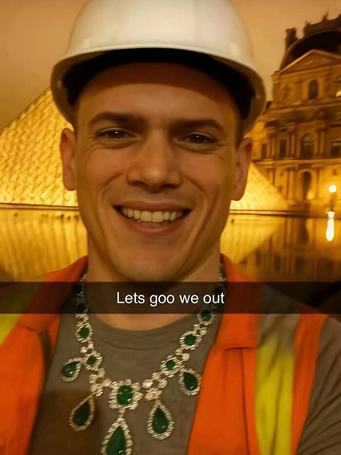 Smiling man in a hard hat and orange vest wearing a large necklace, an entertaining post to help fight boredom and sadness.
