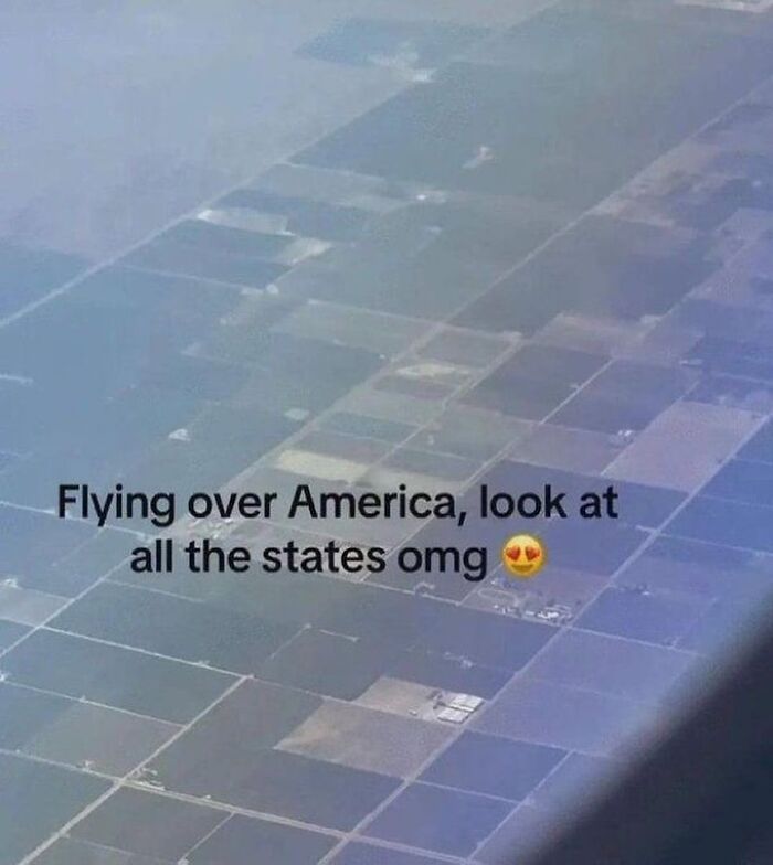 Aerial view showing patchwork farmland from a plane window, a lighthearted post to fight boredom and sadness.