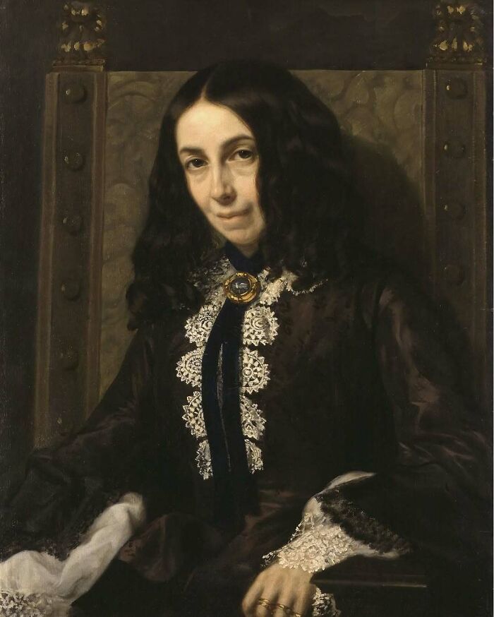 Portrait of a historical woman with dark hair, wearing a lace-trimmed dress, representing overlooked women in history.