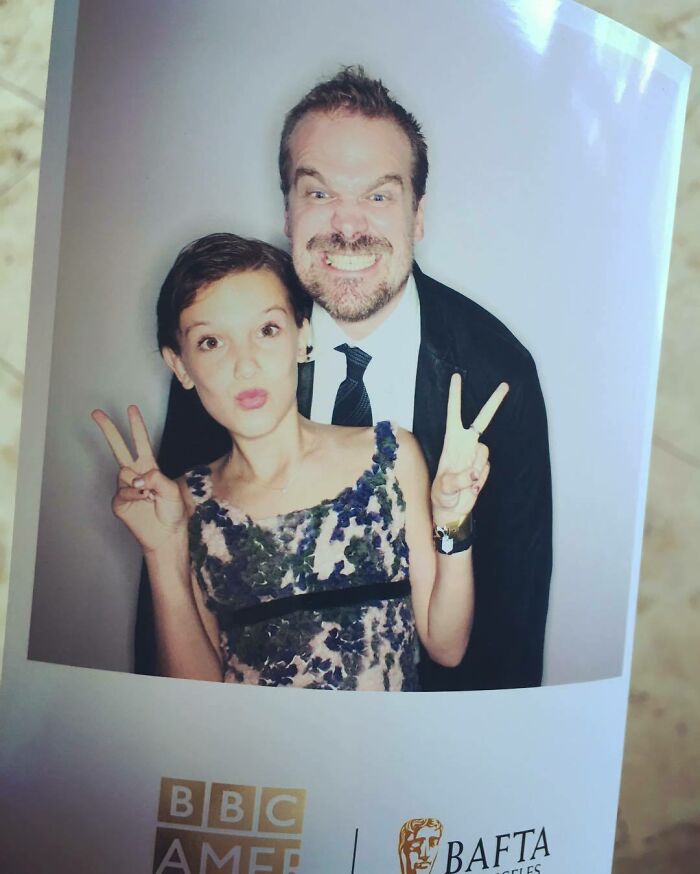 Millie Bobby Brown and David Harbour posing playfully together at a BBC America and BAFTA event. Millie Bobby Brown and David Harbour posing playfully together at a BBC America and BAFTA event.