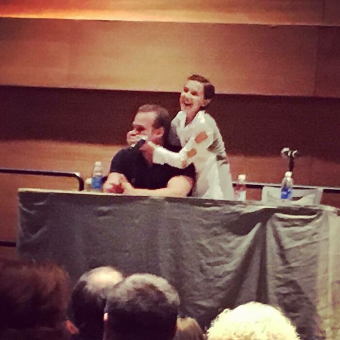 Millie Bobby Brown and David Harbour sharing a joyful moment on stage during a public event discussing their relationship. Millie Bobby Brown and David Harbour sharing a joyful moment on stage during a public event discussing their relationship.