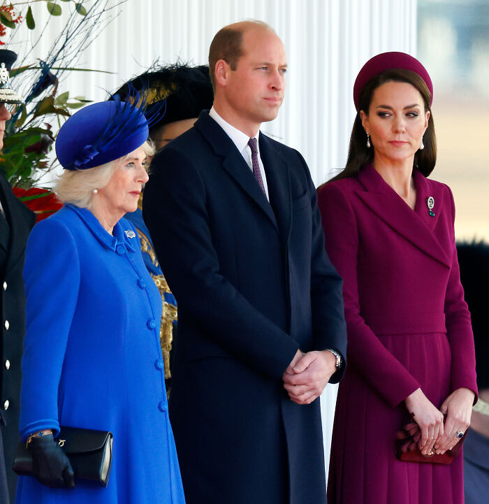 Kate Middleton and Queen Camilla standing together, dressed formally, reportedly influencing Andrew&rsquo;s title removal decision.
