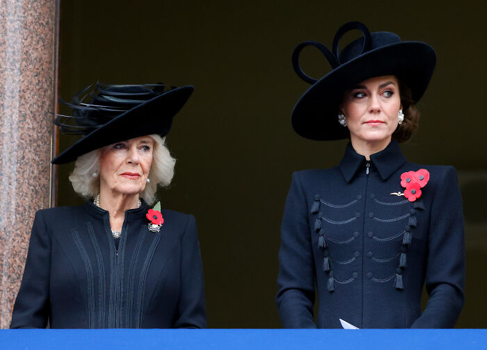 Kate Middleton and Queen Camilla wearing black outfits and hats, highlighting the female touch in royal title removal discussion.