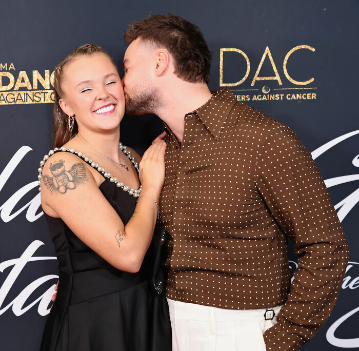 JoJo Siwa's fans react stunned and confused as Chris Hughes makes a surprising confession on reality TV show.