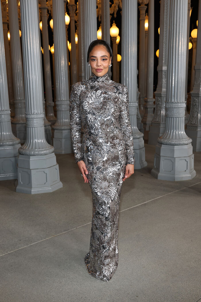 Woman wearing a silver sequin gown at the 2025 LACMA Art and Film Gala showcasing top fashion outfits.