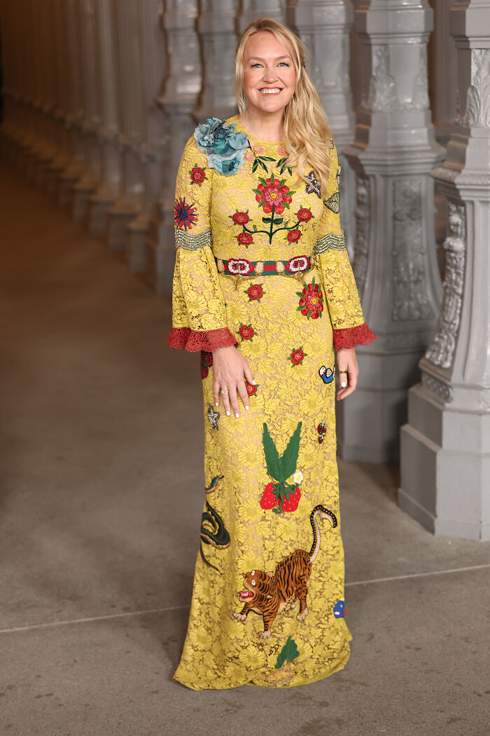 Woman in a yellow floral embroidered dress posing indoors showcasing 2025 LACMA Art and Film Gala outfits.