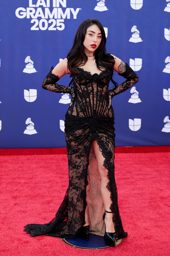 Female star wearing a sheer black lace gown on the red carpet at the 2025 Latin Grammy Awards worst dressed stars event.
