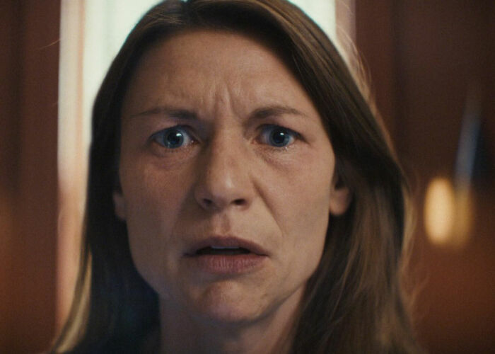 Claire Danes with a quivering chin, close-up showing emotional expression in her new hit show scene.
