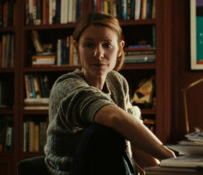 Claire Danes sitting indoors with a quivering chin expression in a scene from her new hit show.