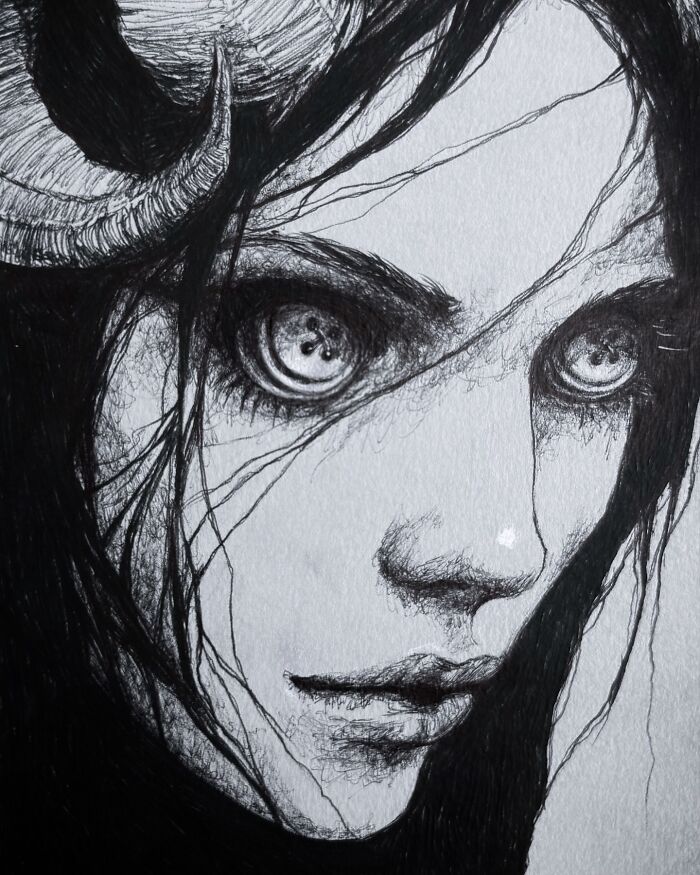 Close-up of a creepy yet gorgeous black and white drawing of a haunting face with eerie eyes and dark hair.