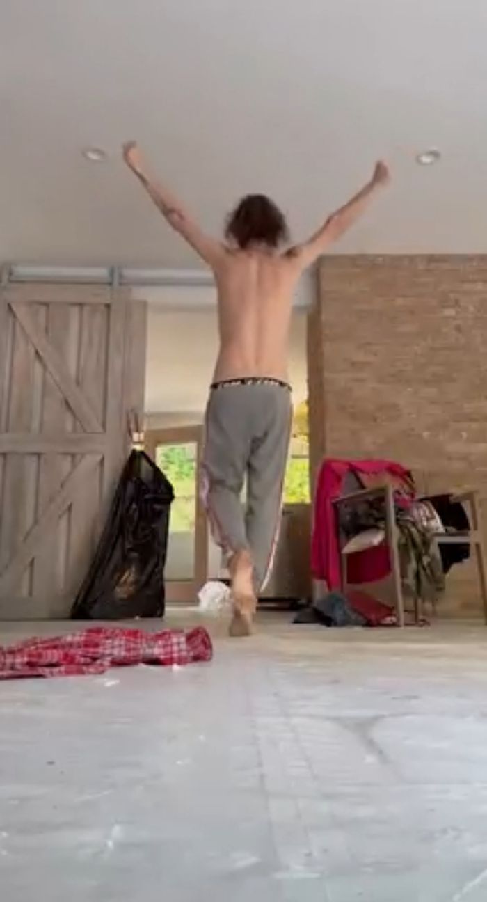 Taryn Manning shirtless with arms raised in a messy room, fans worried after bizarre video circulating online