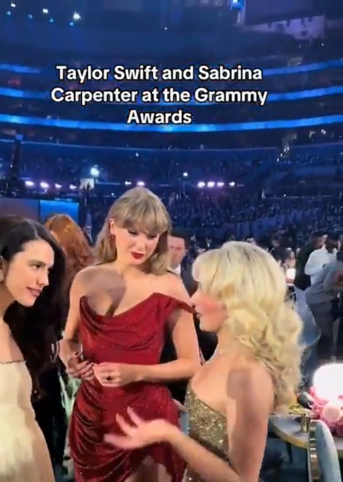 Taylor Swift in red dress talking with Sabrina Carpenter at Grammy Awards in a crowd, highlighting manners debate video.