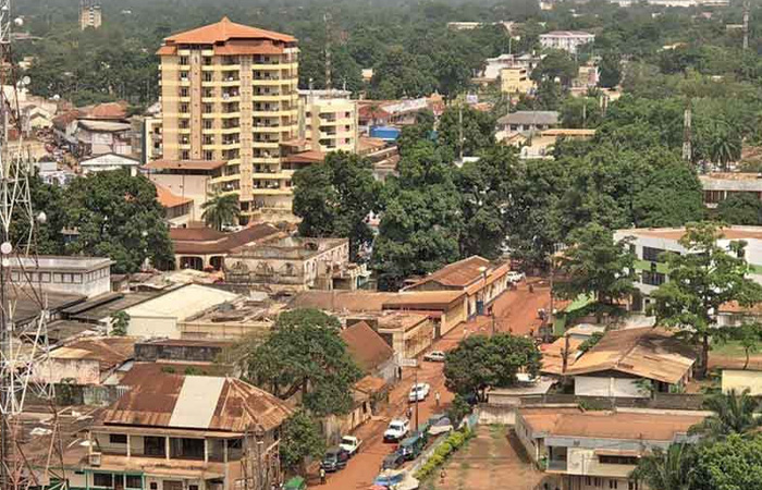 Urban area with old buildings and rusted roofs in one of the poorest countries in the world facing hardship.