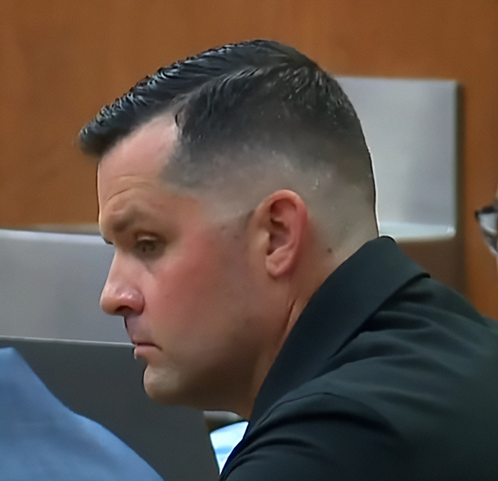 Man with short hair in a courtroom setting, related to chilling details after dad left 2YO in car during video binge. Man with short hair in a courtroom setting, related to chilling details after dad left 2YO in car during video binge.