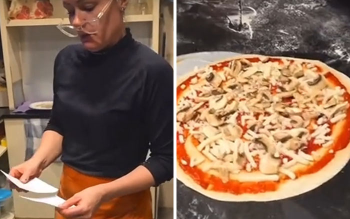 Restaurant owner reading a receipt in kitchen next to a mushroom pizza being prepared on a flour-dusted surface. Restaurant owner reading a receipt in kitchen next to a mushroom pizza being prepared on a flour-dusted surface.