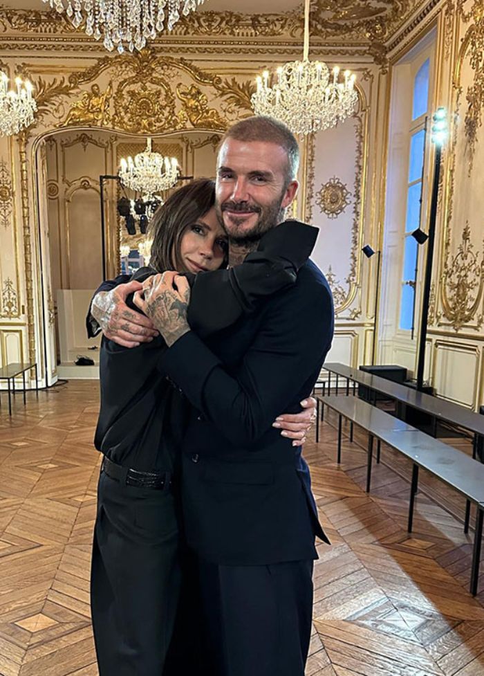 Victoria Beckham and David Beckham hugging in an ornate room as David receives Sir title celebration. Victoria Beckham and David Beckham hugging in an ornate room as David receives Sir title celebration.