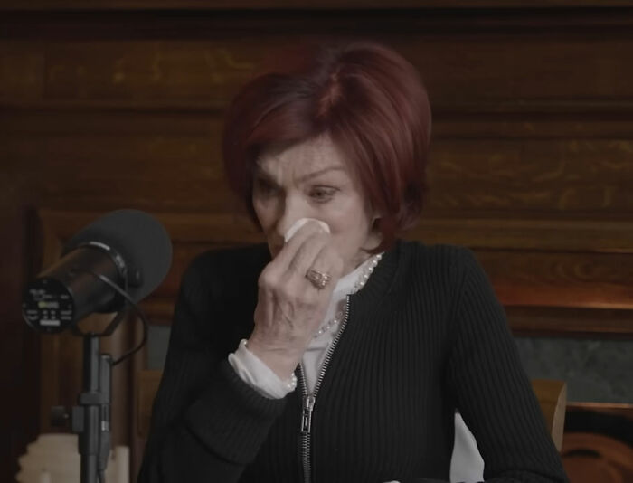 Sharon Osbourne wiping tears during emotional reveal of voicemail Donald Trump left about Ozzy on a podcast.