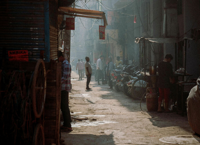 People gathered on a sunlit street sharing stories about the great things in the US community and culture.