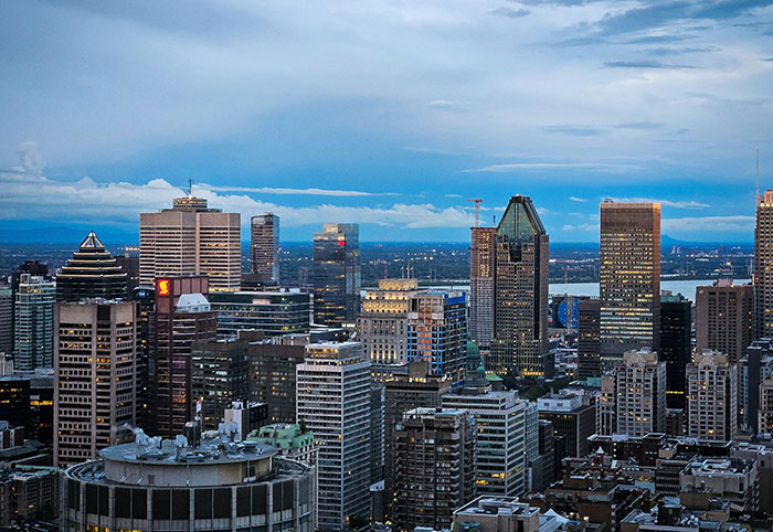 City skyline at dusk representing American expats noticing cultural differences in Canada’s urban environment.