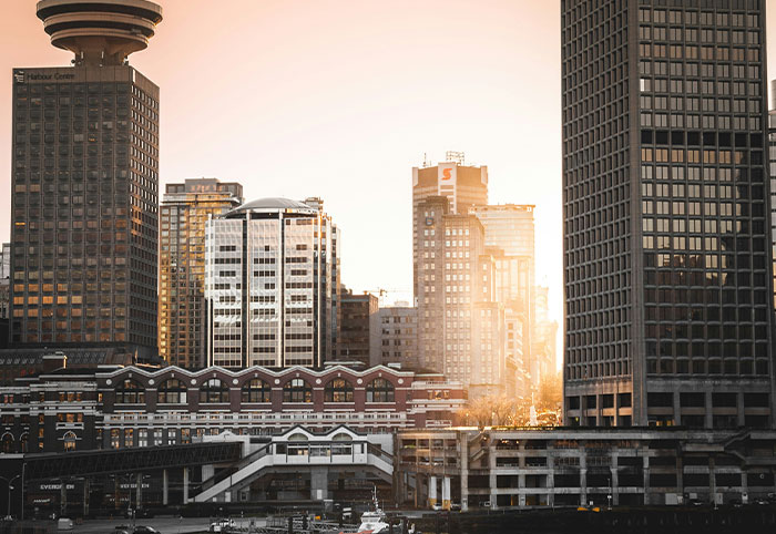 Downtown cityscape at sunset illustrating urban life American expats notice in Canada’s culture and environment.