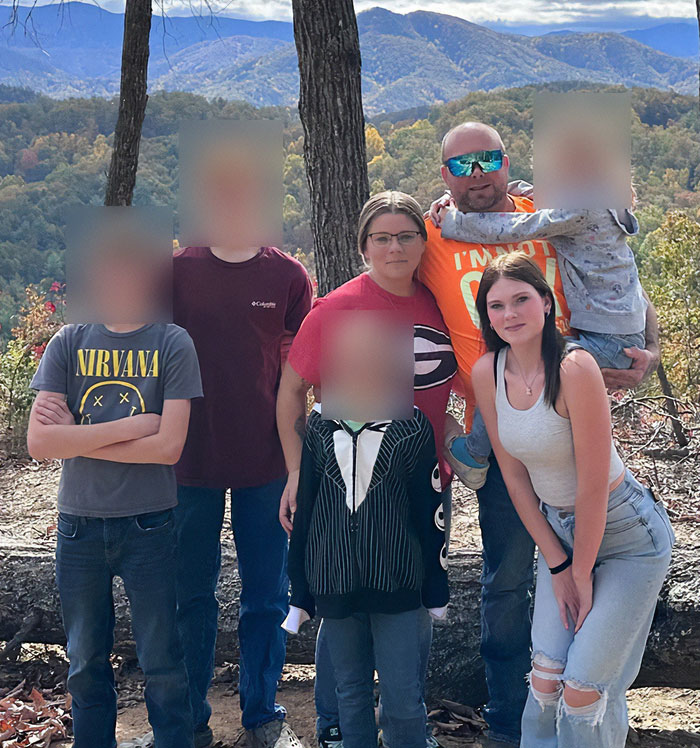 Family group photo outdoors with blurred faces, stepsibling under investigation after teen's body found on Carnival Cruise