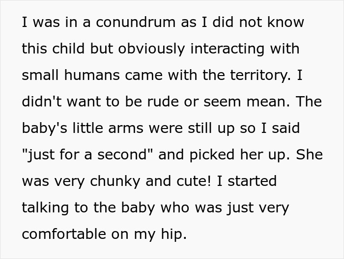 Theme park worker holding an unknown baby comfortably on hip as parents vanish into crowd nearby.